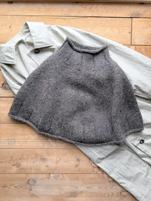 Zoom bild av mönster poncho tweed