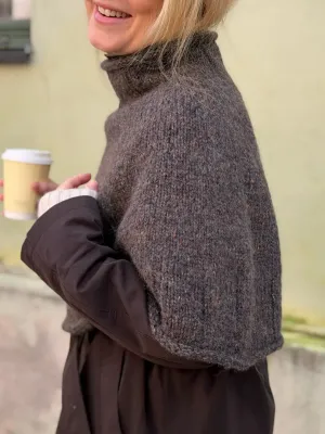 Zoom bild av mönster poncho tweed